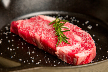Red meat kosher organic steak in a cast iron skillet potatoes
