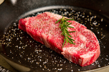 Red meat kosher organic steak in a cast iron skillet potatoes