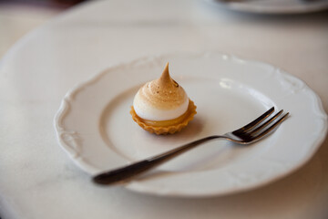 caramel and cream dessert on white porcelain plate 