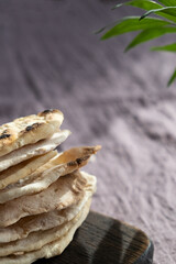 Homemade matzo with microgreen peas. Unleavened flatbread bread. Pesah celebration concept. Jewish Passover background. Pita.