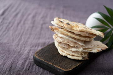 Homemade matzo with microgreen peas. Unleavened flatbread bread. Pesah celebration concept. Jewish Passover background. Pita.