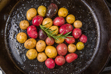Small colorful potatoes in a skillet cast iron pan