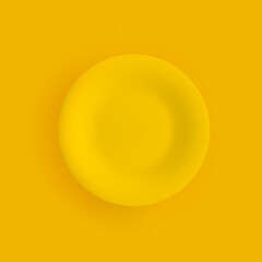 Flat matte yellow dinner plate closeup on a yellow background. Isolated object with shadow. Top view