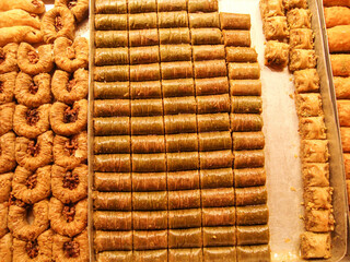 oriental sweets. traditional Turkish baklava with pistachios, Turkish delight, sherbet and halva