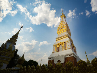 The Pagoda of Wat Phra That Panom temple in Nakhon Phanom, Thailand in cloudy blue sky day with sunlight