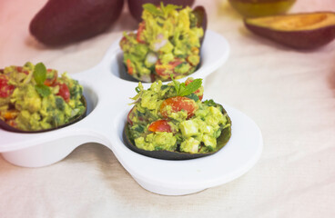 In selective focus of Avocado salad mixed,serving on white bowl