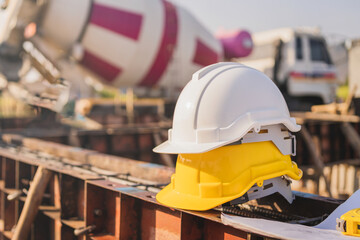 yellow and white helmet safety in construction site
