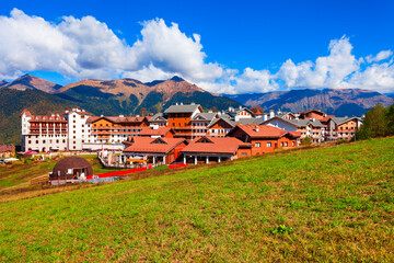 Buildings in Rosa Plateau mountain village. Rose Plateau and Roza Khutor are alpine ski resorts near Krasnaya Polyana town in Sochi region, Russia. © saiko3p