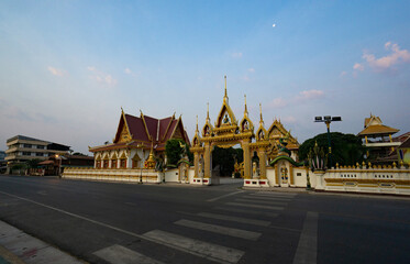Nakhon Phanom, Thailand - February 12, 2020; Street view of Entrance of Wat Phra In Plaeng temple at dawn