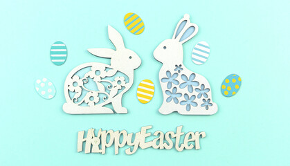 Fototapeta premium Easter poster and banner concept on a pastel blue background with text and cute easter bunny