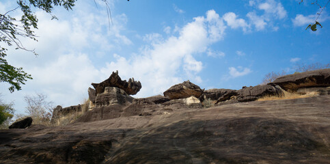 Naklejka premium Phu Pha Thoep National Park a small protected area in Mukdahan Province east of Thailand near the border to Laos with cloudy blue sky background