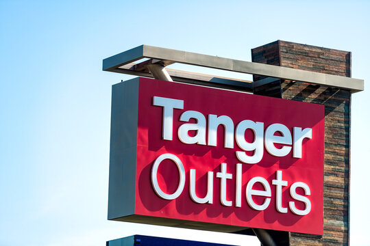 Daytona Beach, USA - May 10, 2018: Closeup of Tanger Factory Outlets shopping center retail mall sign in Florida city town with designer stores shops