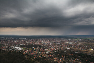 Fototapeta premium View on the Vršac city under the rainy clouds