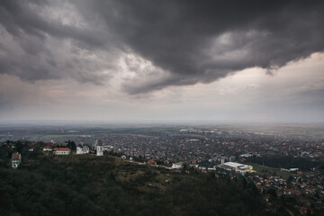 Fototapeta na wymiar View on the Vršac city under the rainy clouds
