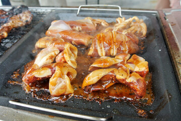 The squid is sliced and marinated with spices. Grilled on a frying pan.