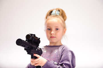 little girl with guns, in the studio