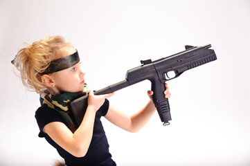 little girl with guns, in the studio