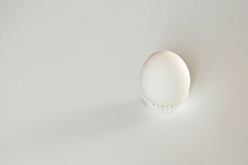 White egg on a white isolated background with shadow. Ingredient.Healthy food.Easter.