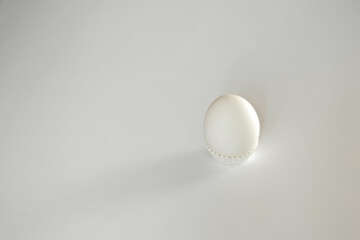 White egg on a white isolated background with shadow. Ingredient.Healthy food.Easter.