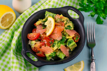 Salad with smoked salmon, avocado and cherry tomatoes