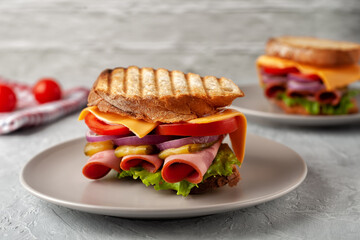 Sandwich with ham, tomatoes, lettuce and yellow cheese