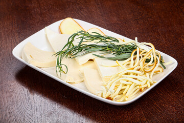 Caucasian tradition cheese plate served herbs