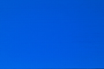 Blue painted plywood forms the background