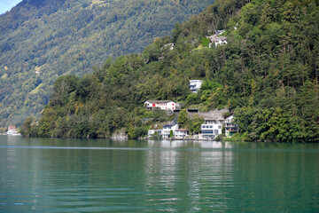 Fototapeta na wymiar Several houses on the edge of the lake