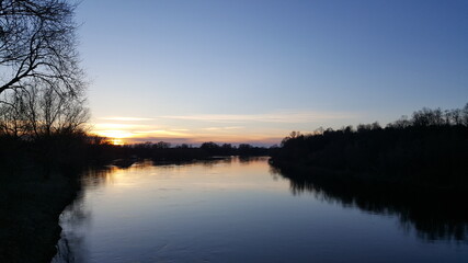 Naklejka na ściany i meble sunset over the river