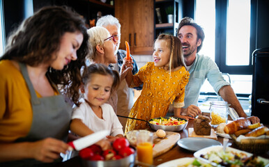 Portrait of happy family in kitchen at home