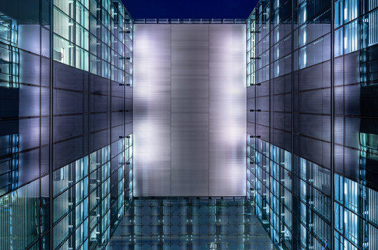 Modern Glass Building In City At Night