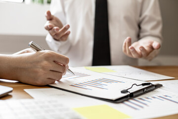 The finance department is presenting company financial information to executives and meeting attendees at the big monthly meetings, to summarize the company's performance. Financial concept.