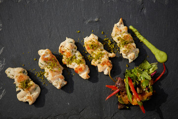 Fried Chicken with Korean Sauce on black dish. Shallow dof