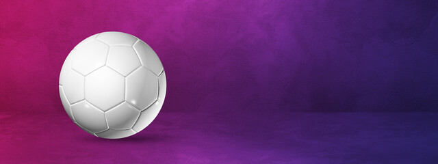 White soccer ball on a purple studio banner