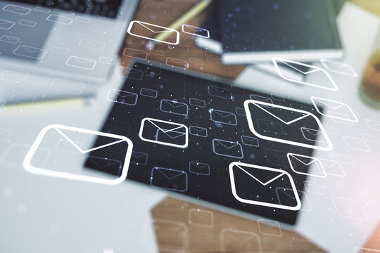 Creative concept of postal envelopes illustration and digital tablet on background, top view. Email and communications concept. Multiexposure