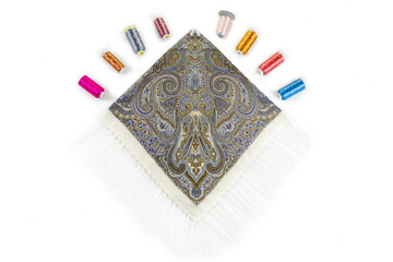 top view on beige cotton scarf with fringe and paisley ornament designed in flat lay