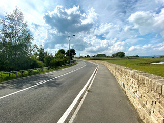 Large derelict Victorian,  stone built textile mill, overgrown with trees, and bushes, in the centre of, Bradford, Yorkshire, UK