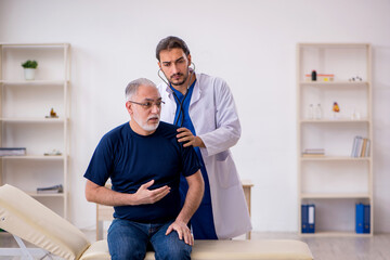 Old male patient visiting young male doctor