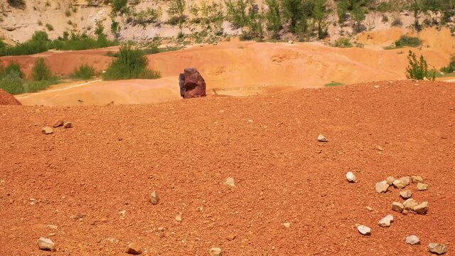Red stones and rocks in bauxite mine. Gant, Hungary