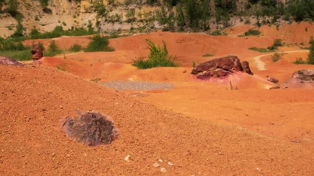 Red stones and rocks in bauxite mine. Gant, Hungary