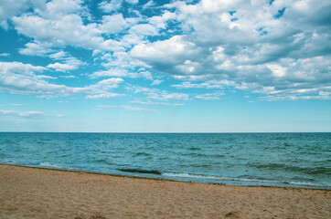 Seascape background wavy blue sea and sky with clouds