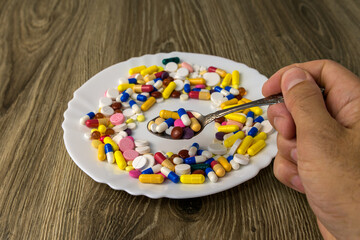 A bunch of pills on a plate