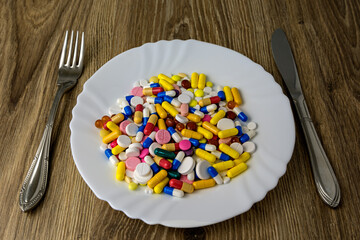 A bunch of pills on a plate