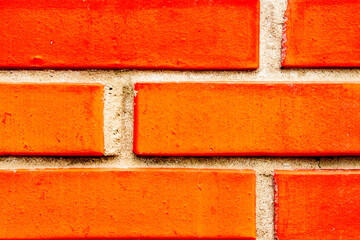 Texture of a brick wall with cracks and scratches which can be used as a background