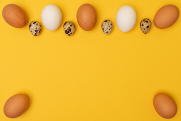 Easter eggs on a yellow background, place for an inscription in the center