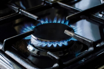Burning blue gas on the stove.