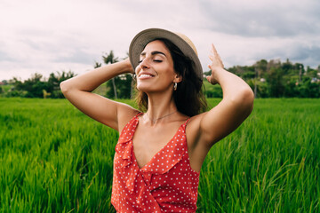 Happy woman enjoying nature in countryside