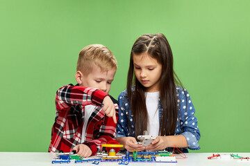 children playing with electronic constructor at studio