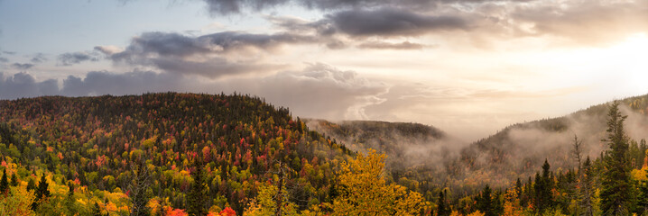 Beautiful panoramic view of Canadian Landscape on the Atlantic Ocean Coast during an Autumn Season. Dramatic Sunset Sky Art Render. Taken near Grande-Vallee, Quebec, Canada.