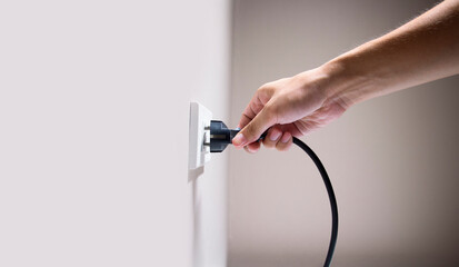 Hand connecting electrical plug cause electric shock, Idea for causes of home fire, Electric short...